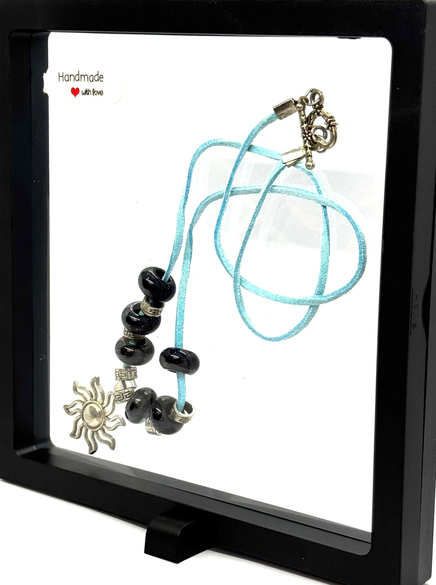 Sky Blue Cord Sun Charm Necklace | 23” Handmade Beaded Necklace | Black Glass Beads | Toggle Clasp Statement Piece