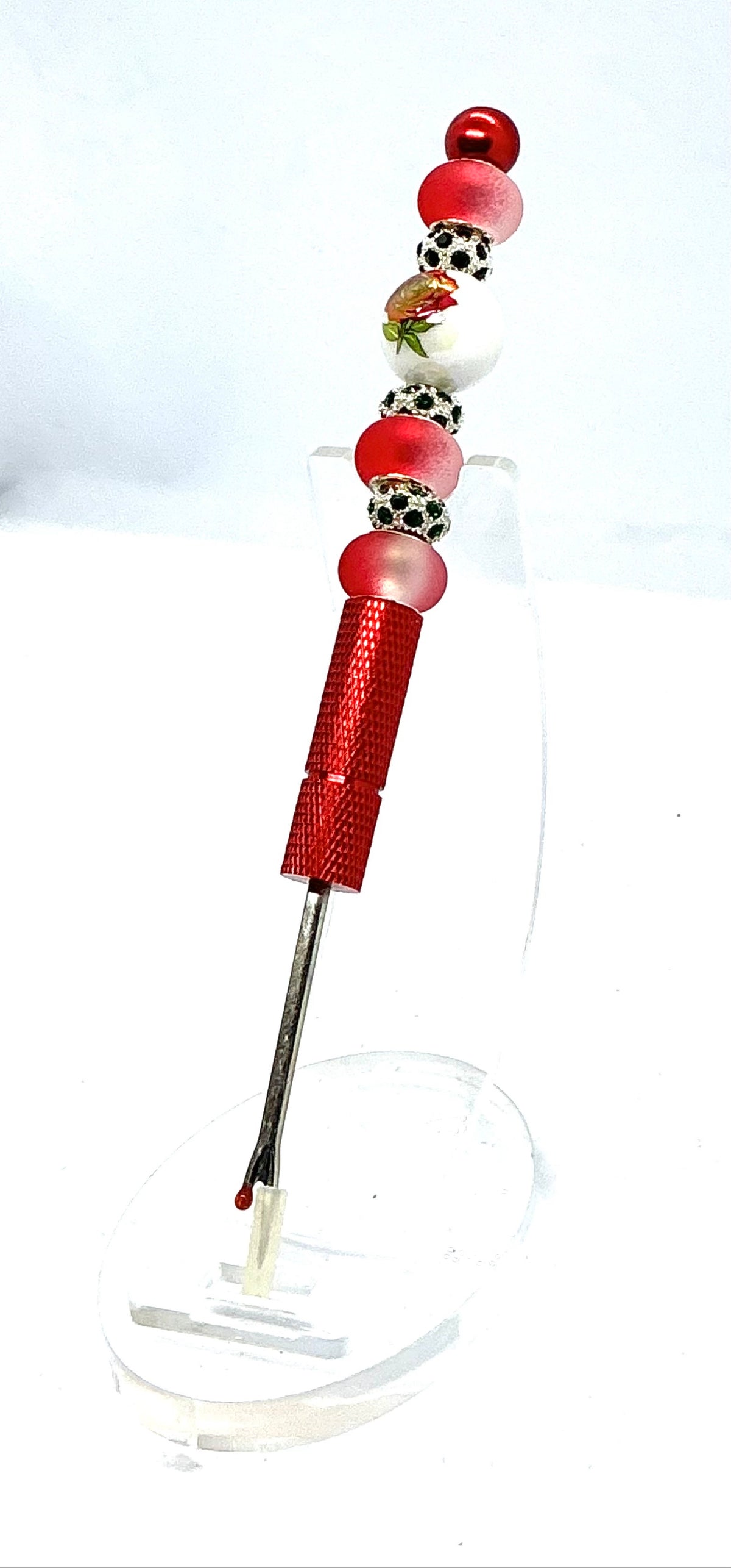 Beaded seam ripper with painted red rose bead and frosted red beads on a red handle