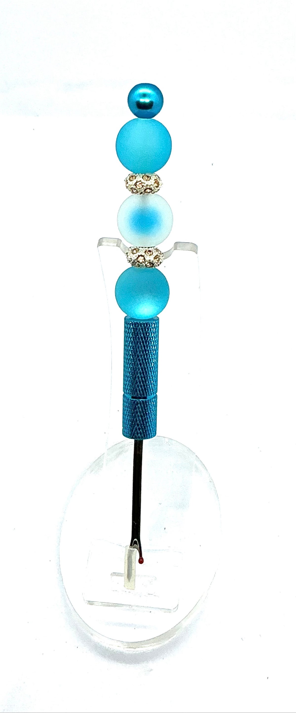 Beaded seam ripper with frosty blue beads and rhinestone spacers on a sky blue handle