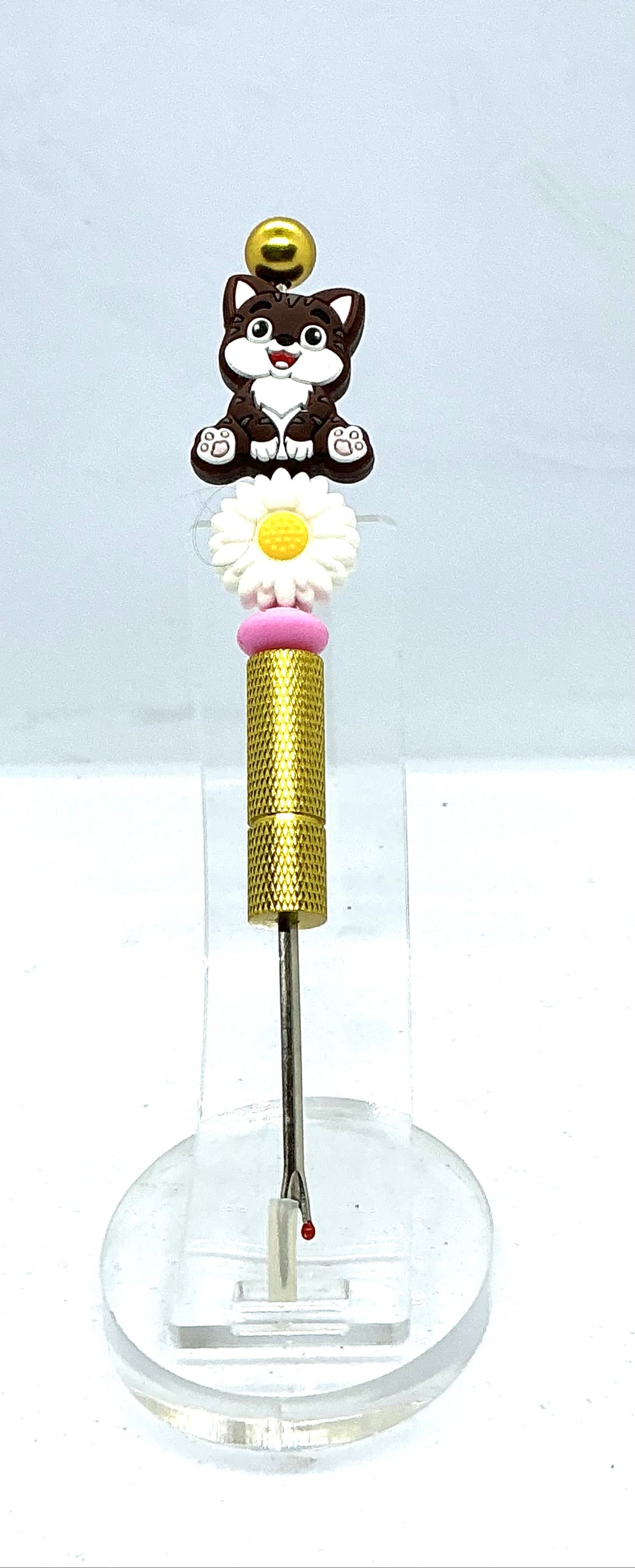 Beaded seam ripper with tabby cat and daisy beads on a gold-tone handle