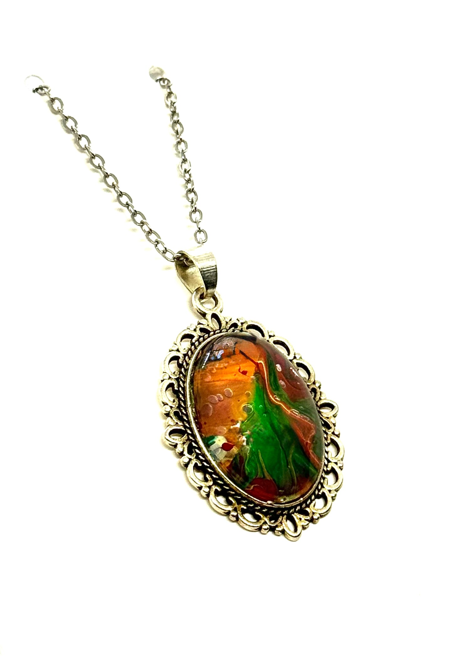 #23 “Don’t Look Too Long” Oval Pendant Necklace – Orange, Green & Red Paint Pour with Hidden Faces