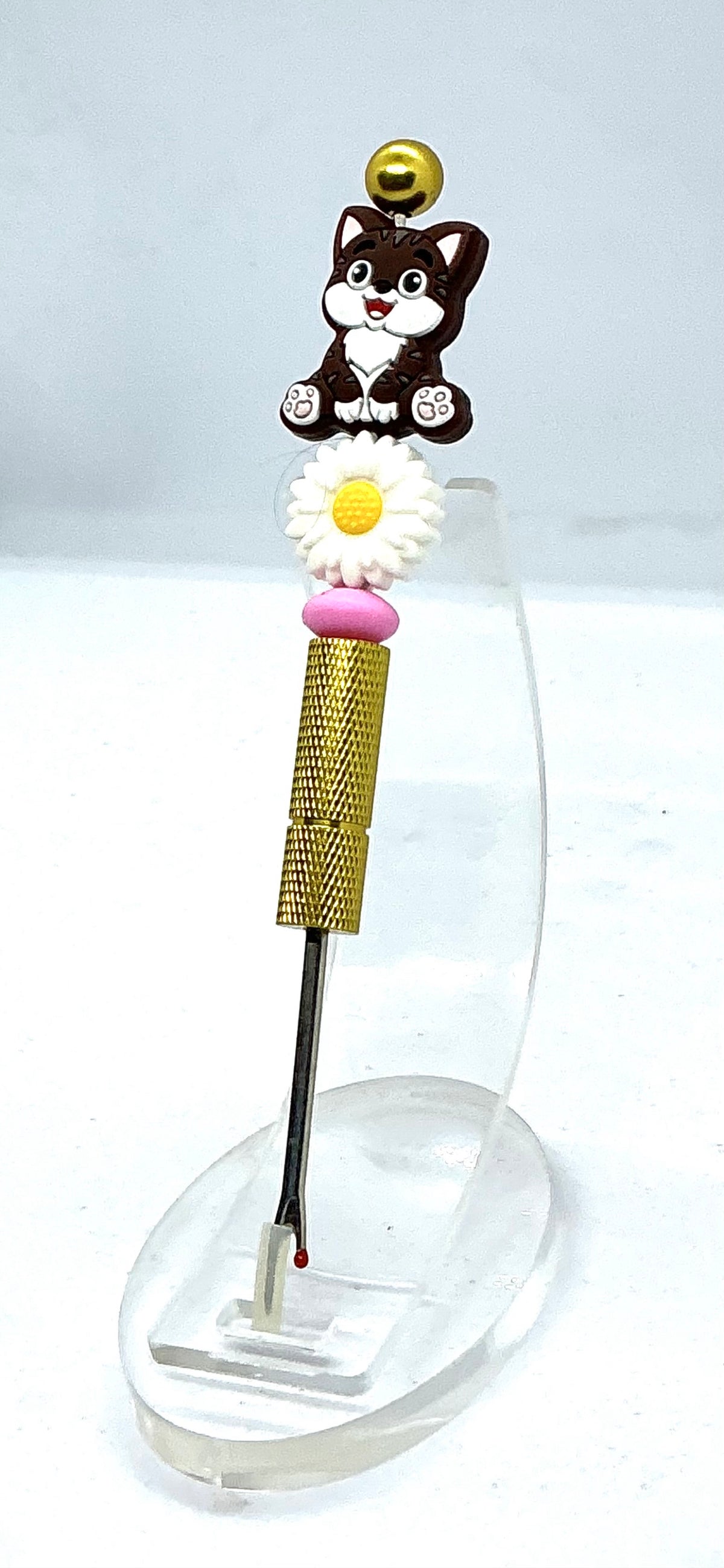 Beaded seam ripper with tabby cat and daisy beads on a gold-tone handle