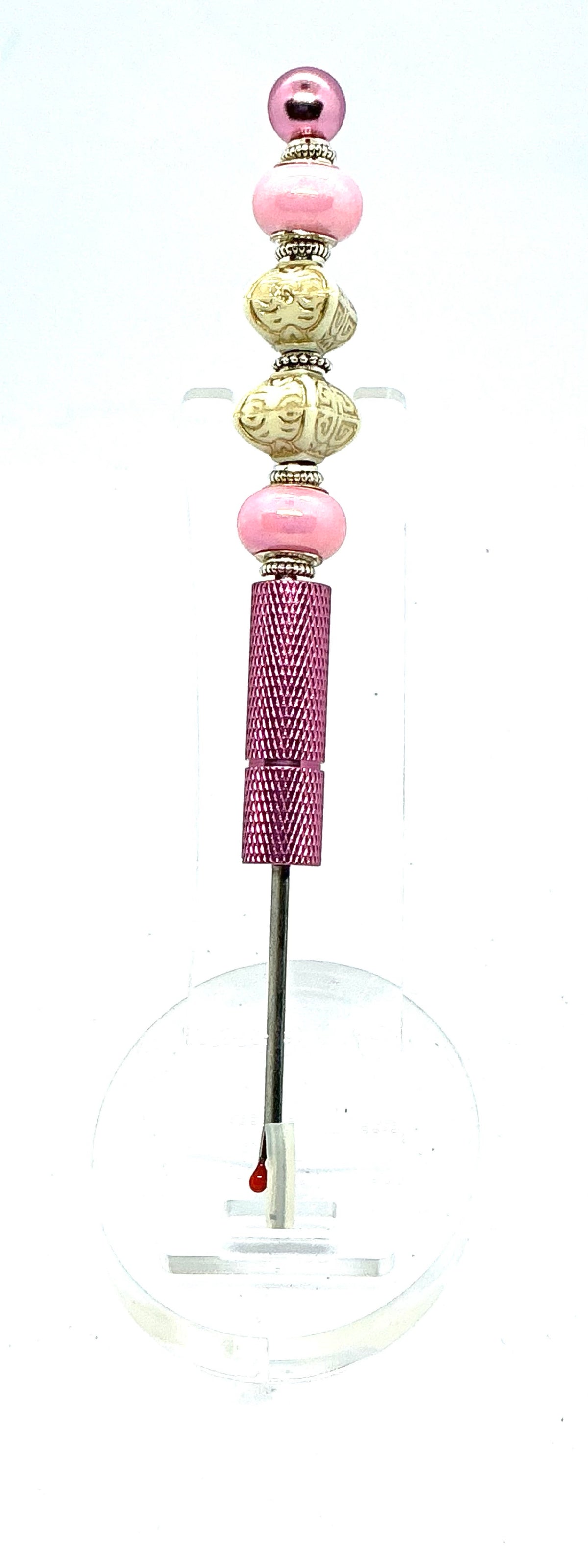 Beaded seam ripper with pink pearl and carved ivory-look beads on a pink handle