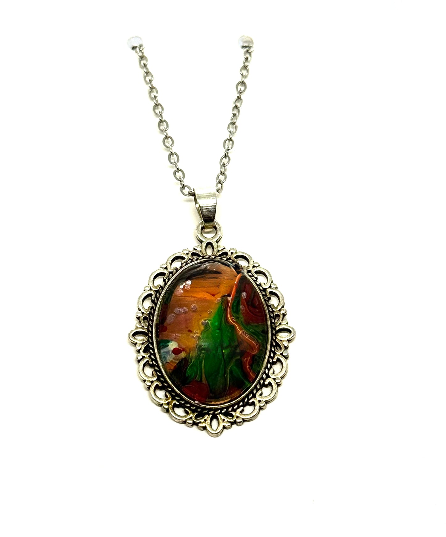 #23 “Don’t Look Too Long” Oval Pendant Necklace – Orange, Green & Red Paint Pour with Hidden Faces
