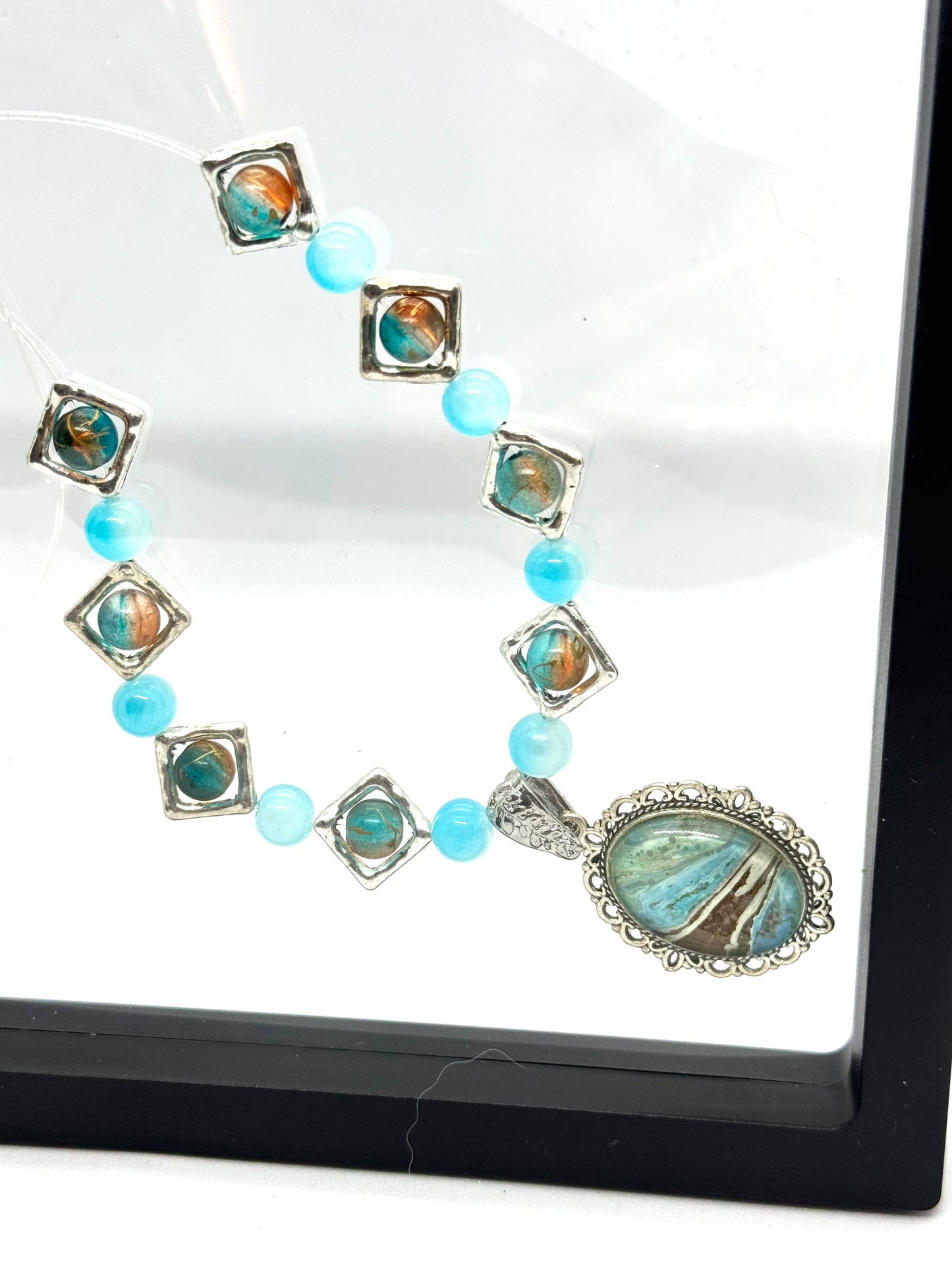Ocean Current Necklace – Handmade Aqua Beaded Necklace with Coastal Artisan Pendant