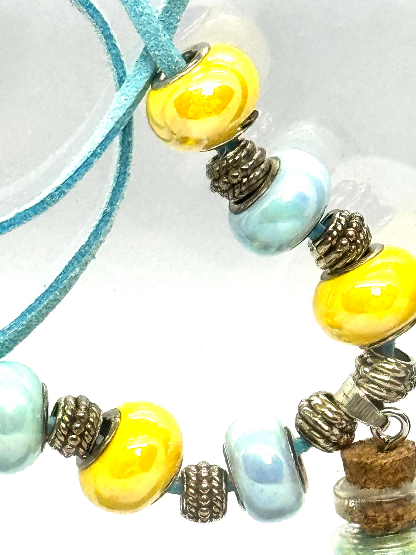 “Calm on the Surface, Chaos in a Bottle” Blue Cord Beaded Necklace | 32” | Toggle Clasp | Glitter Bottle Pendant
