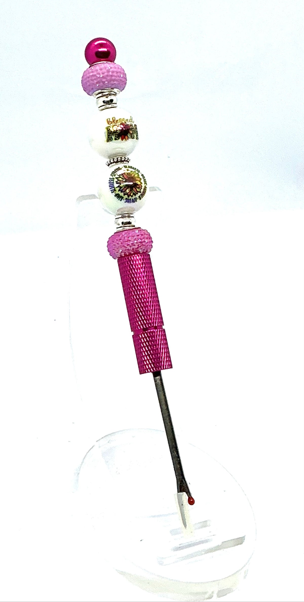 Beaded seam ripper with blessed mom and sunflower beads on a hot pink handle