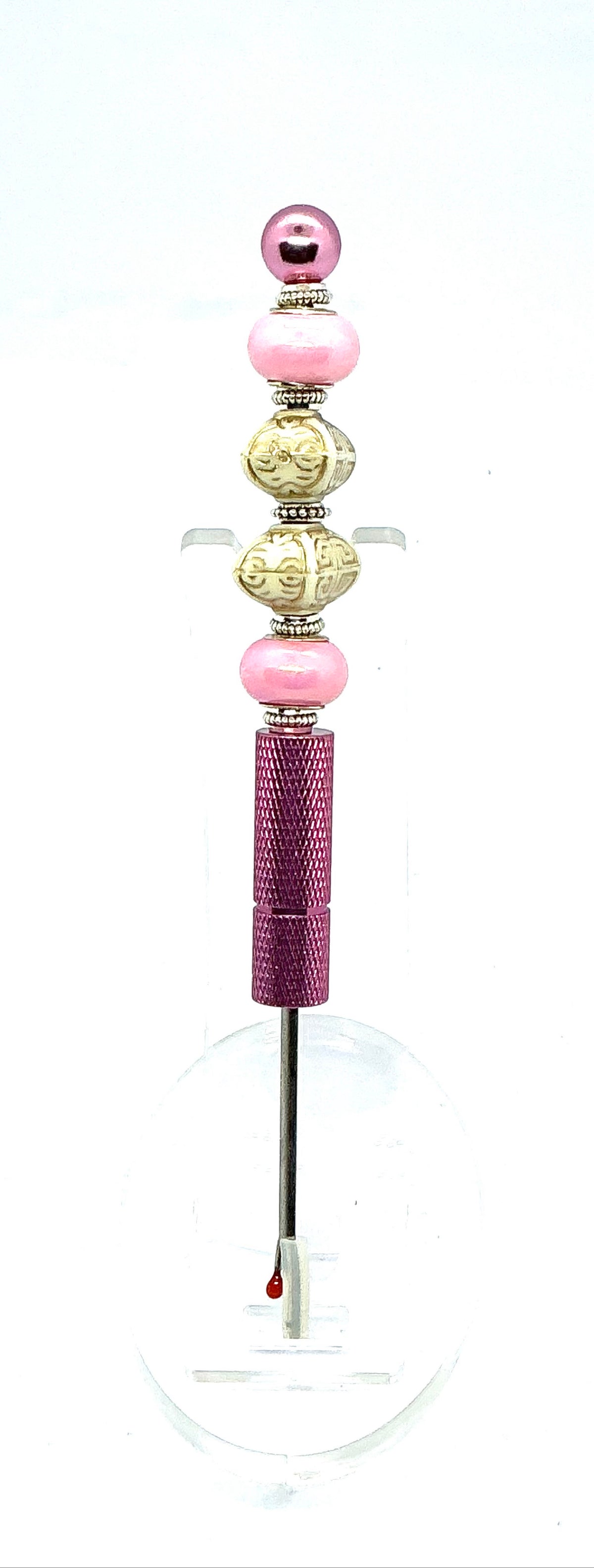 Beaded seam ripper with pink pearl and carved ivory-look beads on a pink handle