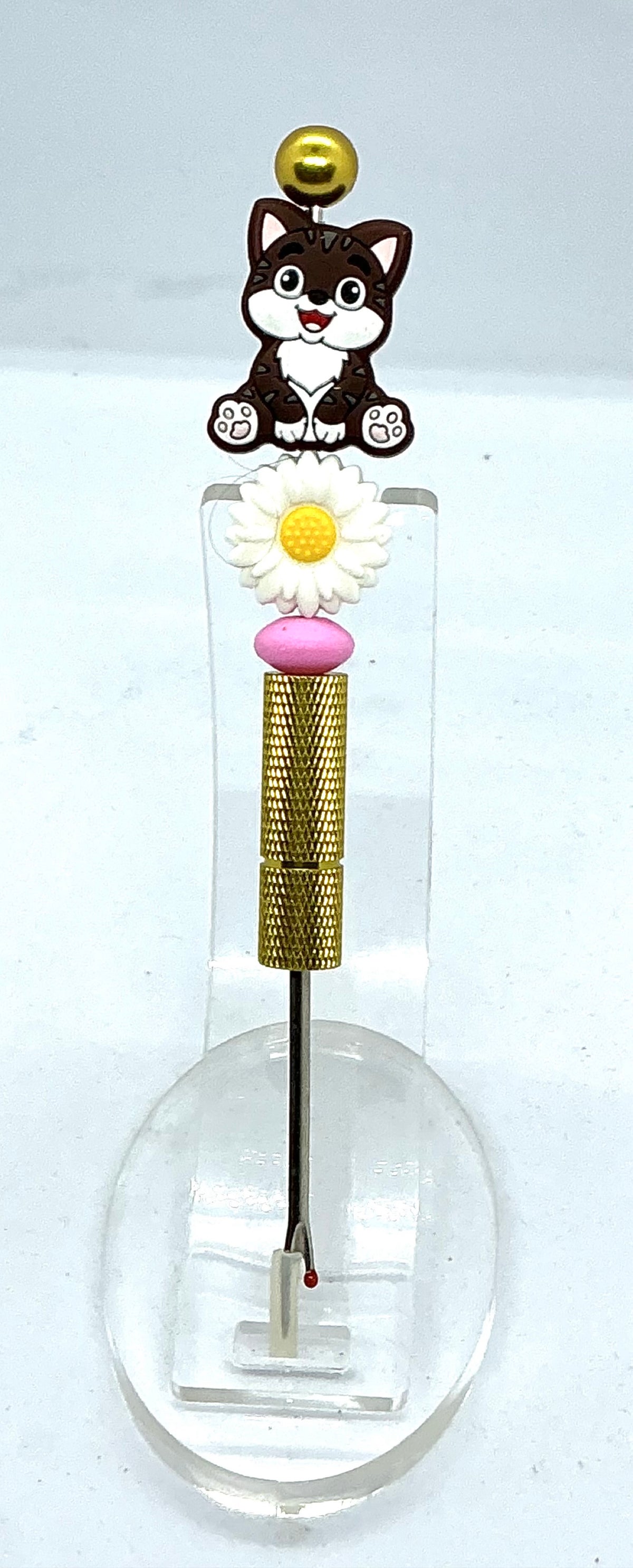 Beaded seam ripper with tabby cat and daisy beads on a gold-tone handle