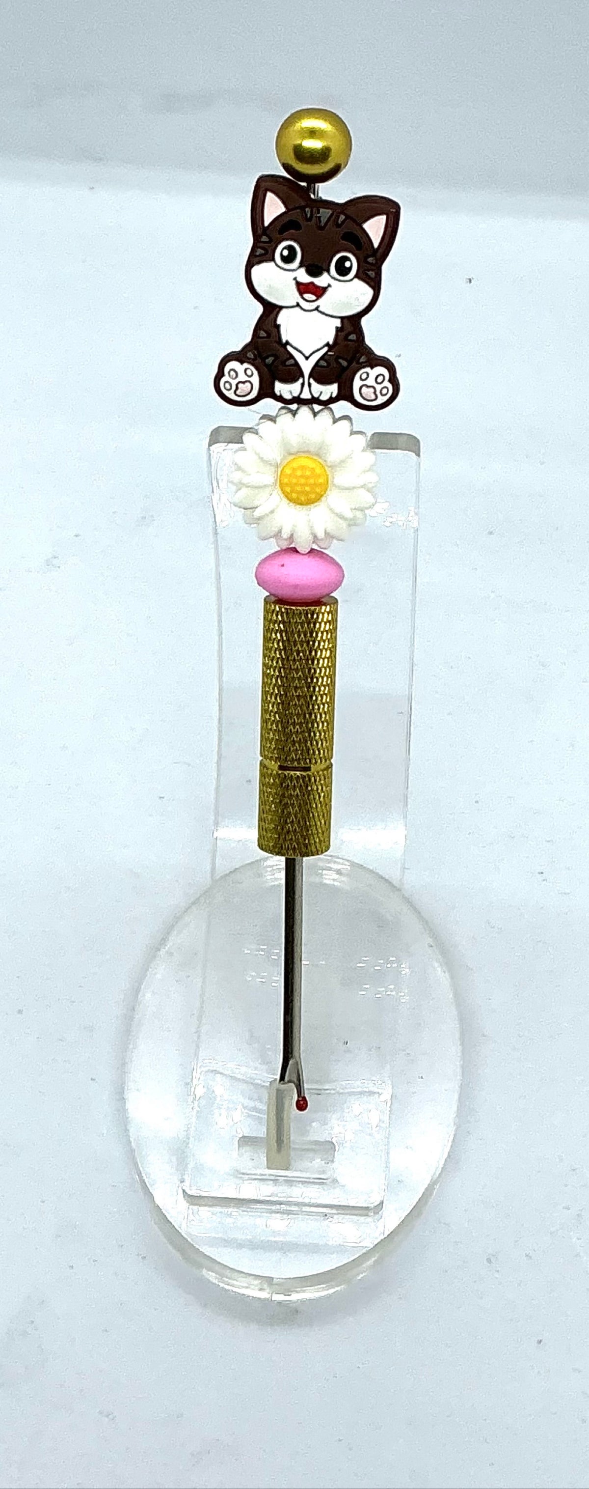 Beaded seam ripper with tabby cat and daisy beads on a gold-tone handle