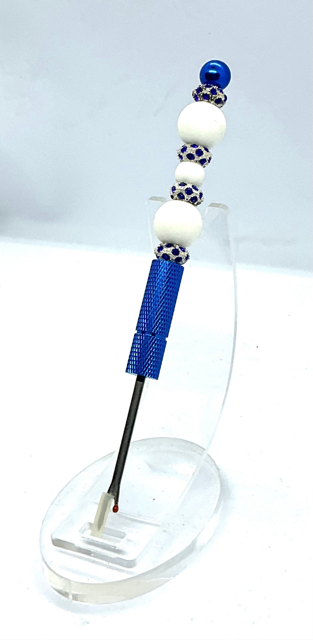 Beaded seam ripper with white beads and royal blue rhinestone spacers on a royal blue handle