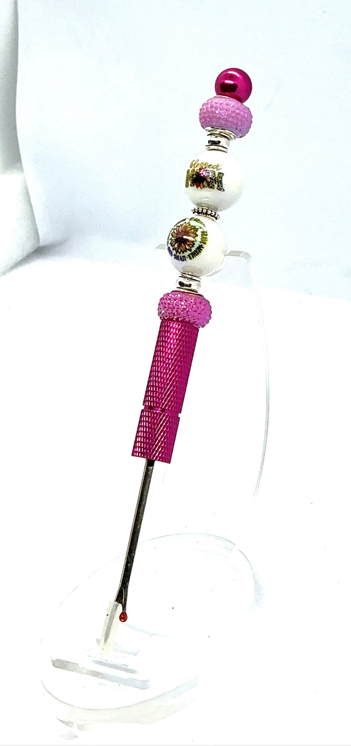 Beaded seam ripper with blessed mom and sunflower beads on a hot pink handle